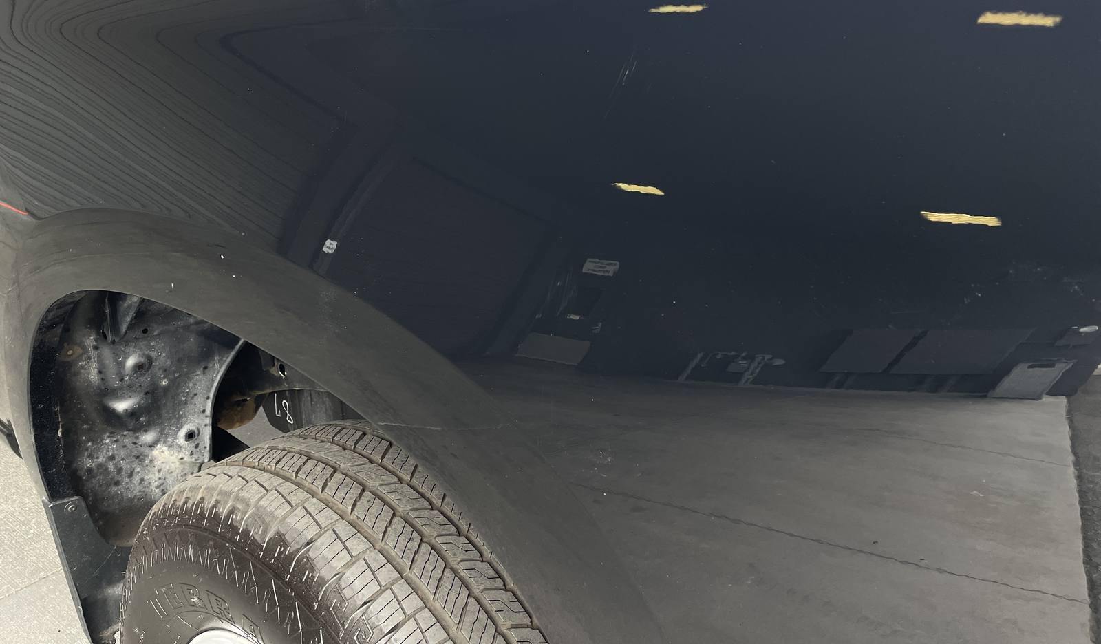 After: Scuffs on a rear quarter, black truck