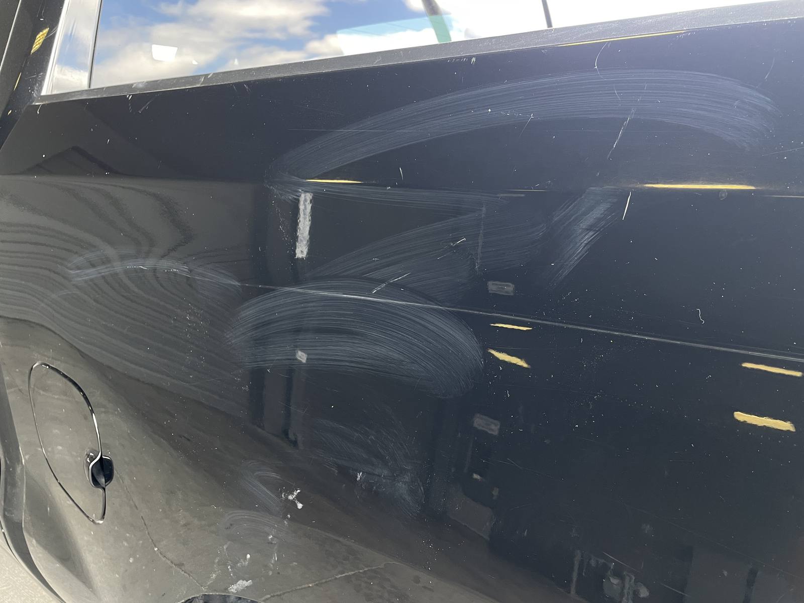 Before: Arcing scuffs and transfer, black truck
