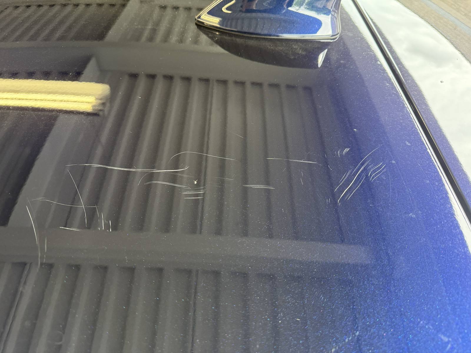 Before: Hood scratches, blue metallic